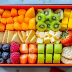 A colorful kid’s lunchbox with healthy foods